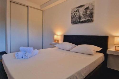 Postel nebo postele na pokoji v ubytování Appt Perle de Corail face au lagon de St-Leu