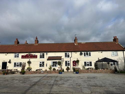 a large white building with at Welbury Studio Retreat - Sleeps 2 in Northallerton