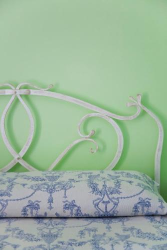 a white bed frame with a pillow in a room at Hotel Residence Mendolita in Lipari