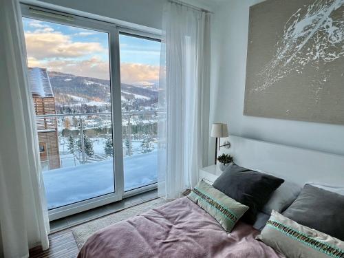 Postel nebo postele na pokoji v ubytování E.5 Ach Beskidy - Magiczny Horyzont, Wisła