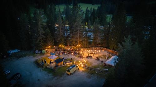 an aerial view of a gathering at night at Camping Sass Dlacia in San Cassiano