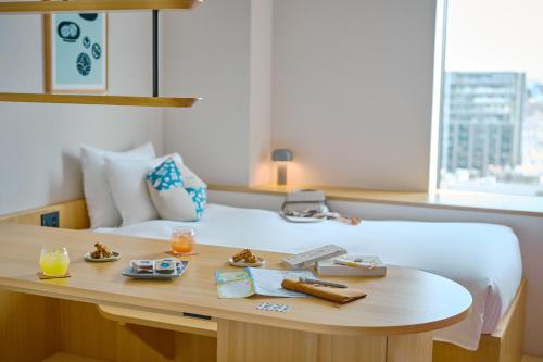 Voodi või voodid majutusasutuse OMO5 Kumamoto by Hoshino Resorts toas