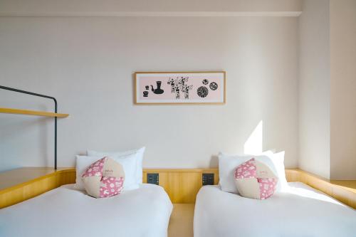 Voodi või voodid majutusasutuse OMO5 Kumamoto by Hoshino Resorts toas