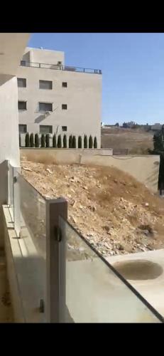 a view of a building from the roof of a building at Omar in Al Bunayyāt ash Shamālīyah