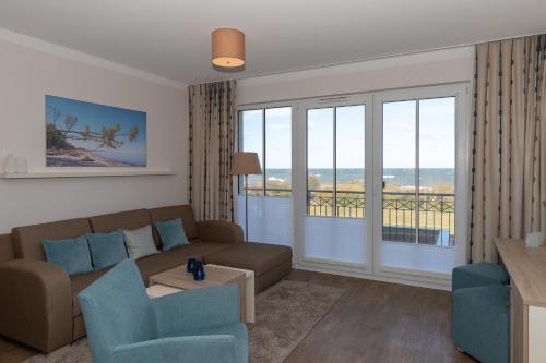 Posezení v ubytování Aparthotel Waterkant Suites - Fewos am Meer mit SPA