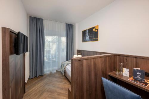 TV a/nebo společenská místnost v ubytování Salzburg Hotel Lilienhof