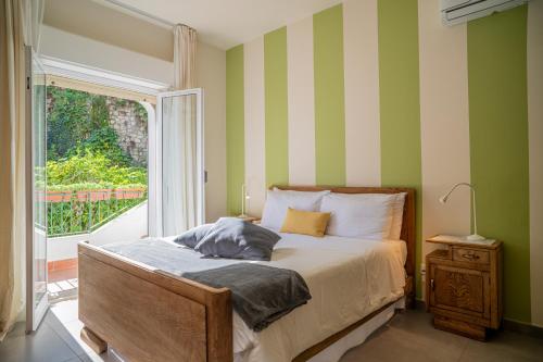 Katil atau katil-katil dalam bilik di Atenasio Garden Suite, Elegance & Relaxation in the Heart of Taormina