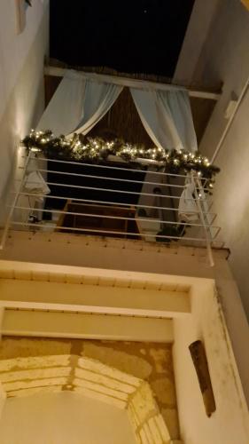 a cow in a cage in a room with lights at Da Lorenza di Casa Camilla Journey in Depressa