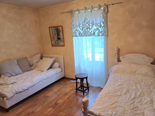 Ένα ή περισσότερα κρεβάτια σε δωμάτιο στο Le Petit Château