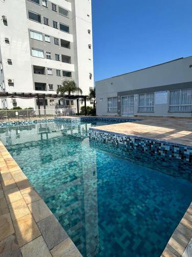 Bazén v ubytování Residencial Órion Condomínio Piscina 250m Praia nebo v jeho okolí