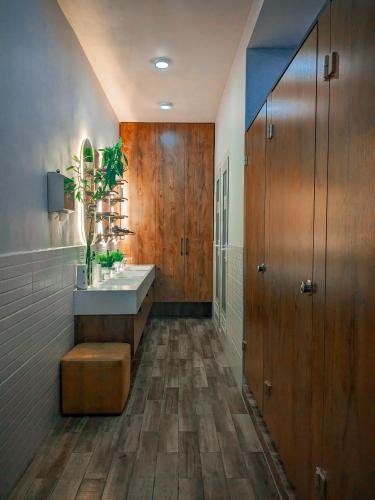 a bathroom with a tub and a sink and a toilet at Aiva Hostel in Bishkek