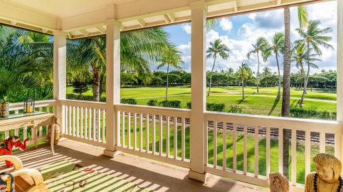a porch with a view of the golf course at Coconut Plantation 1086-4 in Kapolei