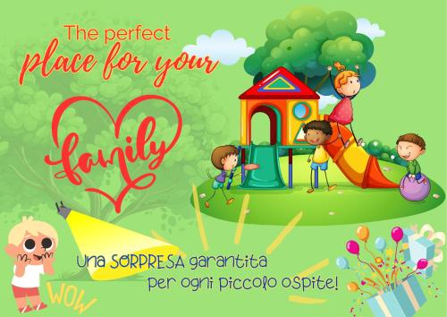 a group of kids playing in the playground with a sign at Casa Vacanze Family in Albisola Superiore