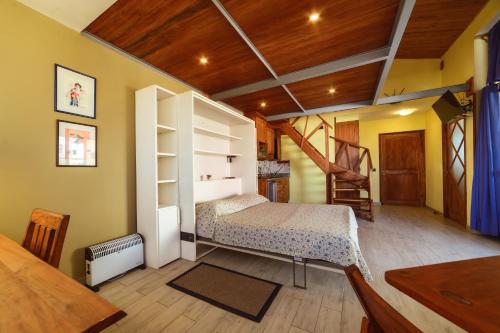 Ένα ή περισσότερα κρεβάτια σε δωμάτιο στο Hotel Chalet des Roses