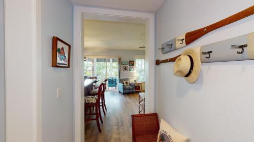 a hallway with a door leading to a living room at Coconut Plantation 1214-2 Aloha Lagoons in Kapolei
