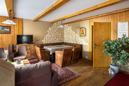 a living room with a couch and a table at Casa Christian in Partenen