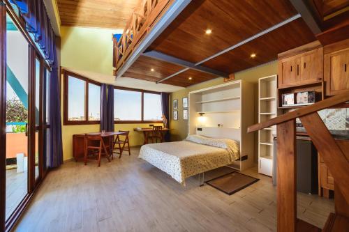 Ένα ή περισσότερα κρεβάτια σε δωμάτιο στο Hotel Chalet des Roses