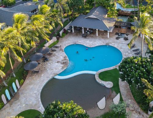 an aerial view of a swimming pool at a resort at Coconut Plantation 1100-2 in Kapolei