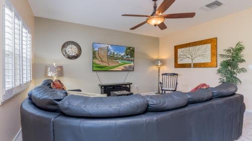 a large blue leather couch in a living room at Coconut Plantation 1192-4 in Kapolei