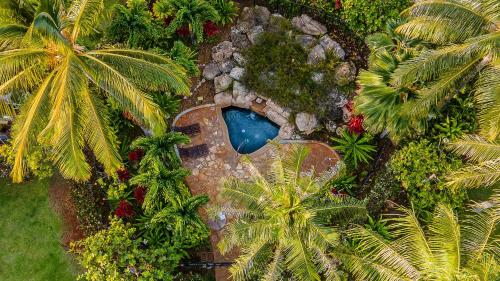 an aerial view of a garden with a swimming pool at Coconut Plantation 1192-4 in Kapolei