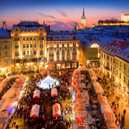 an overhead view of a market in a city at night at Cherry Apartment in Bratislava