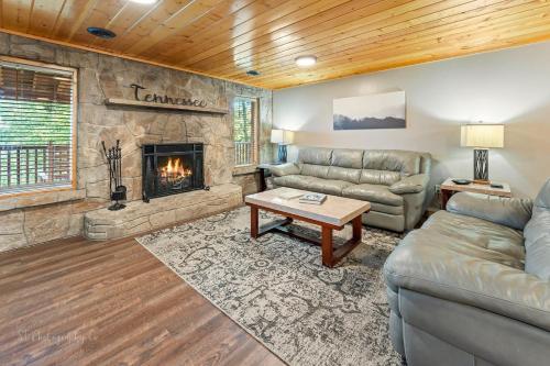 a living room with a couch and a fireplace at Dolly's # 1 condo in Sevierville