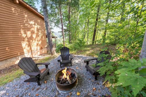 two chairs and a fire pit in a backyard at Dolly's # 1 condo in Sevierville