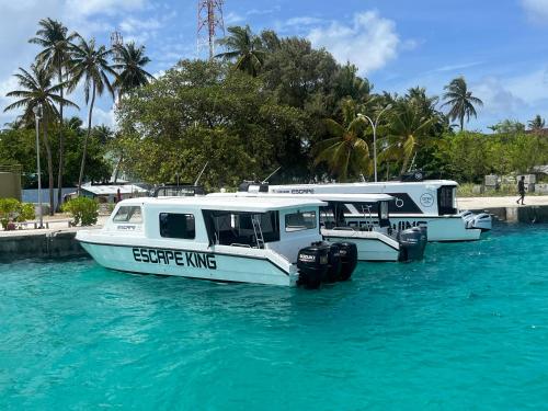 a group of boats parked in the water at Konut by Thakuru in Guraidhoo