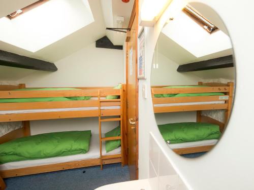 a mirror in a room with bunk beds at YHA Brecon Beacons in Brecon
