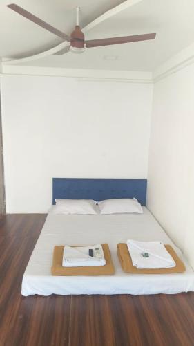 Postel nebo postele na pokoji v ubytování Seadeck Homestay