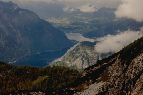 a view of a mountain valley with a lake at Gjaid-Alm 1739m am Dachstein-Only Accessible by Cable Car in Obertraun