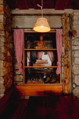 a room with a window with a statue in it at Gjaid-Alm 1739m am Dachstein-Only Accessible by Cable Car in Obertraun