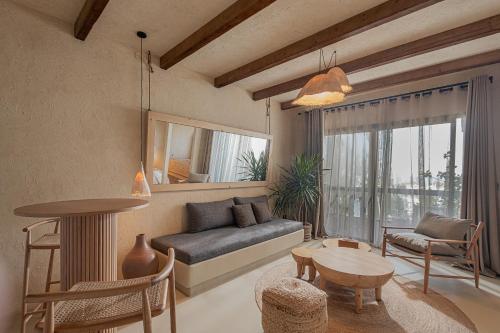 a living room with a couch and a table at Serab Residencia, Boutique Hotel & Resort in Al Kaslīk
