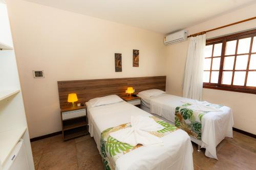 Katil atau katil-katil dalam bilik di Hotel Pousada Salvador Paradise