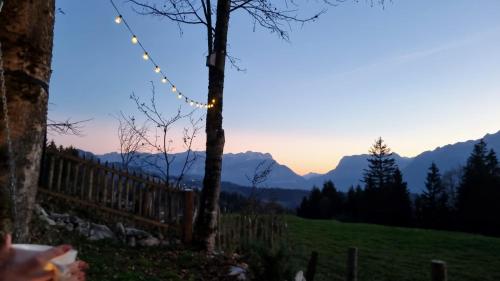 a view of the mountains from the farm at sunset at Chalet SonnSeitn in Bad Vigaun