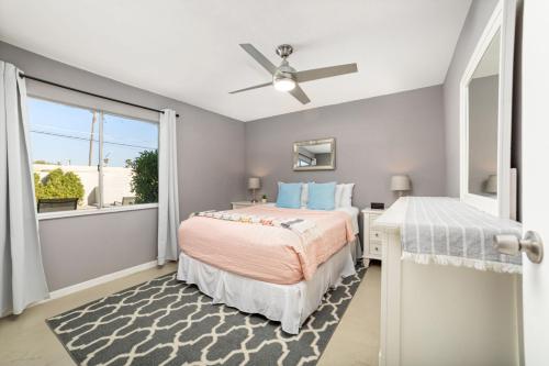 a bedroom with two beds and a window at Cozy Retreat with Pool, BBQ and Fire Pit in Indio