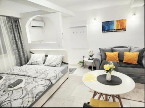 a living room with a bed and a table at Apartment Marina in Kotor