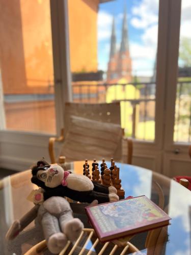 a chess board and toys sitting on a table at Akademihotellet in Uppsala