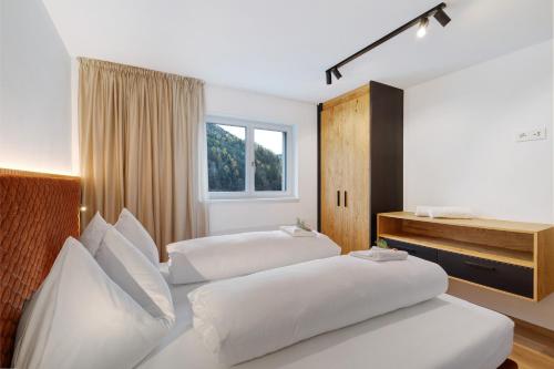 Postel nebo postele na pokoji v ubytování Paradeis Apartments