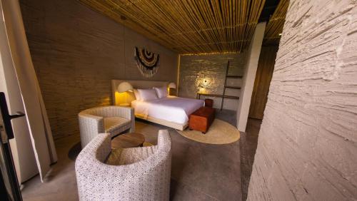 Postel nebo postele na pokoji v ubytování Hotel Casa Tuirak