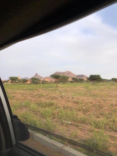 a view of a field from a car window at Dar Toda - Zagora guest house in Zagora