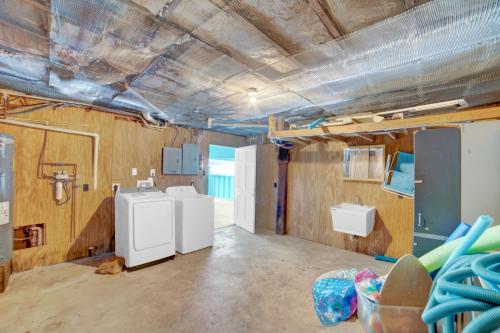 a bathroom with two sinks and two toilets at Fun In The Sun by Vacation Homes Collection in Orange Beach