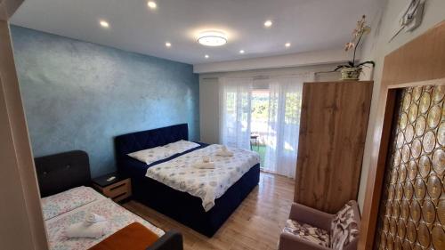 Posteľ alebo postele v izbe v ubytovaní Apartments Ankica