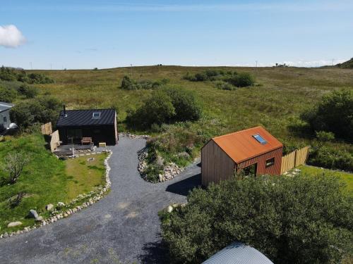 an overhead view of a tiny house in a field at Jura - The Rusty Hut in Craighouse
