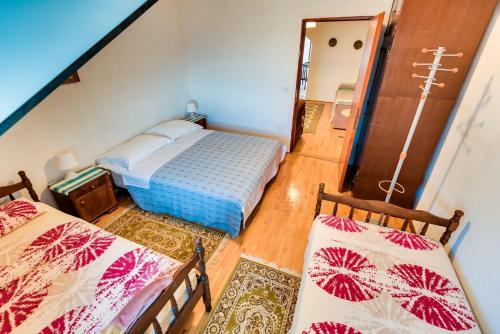 Postel nebo postele na pokoji v ubytování Apartments Land