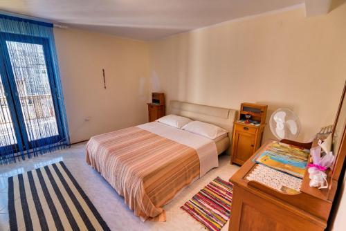 Postel nebo postele na pokoji v ubytování Apartments Land