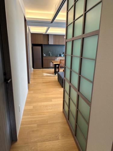 a hallway with a door leading to a kitchen at SuiShou in Kutchan
