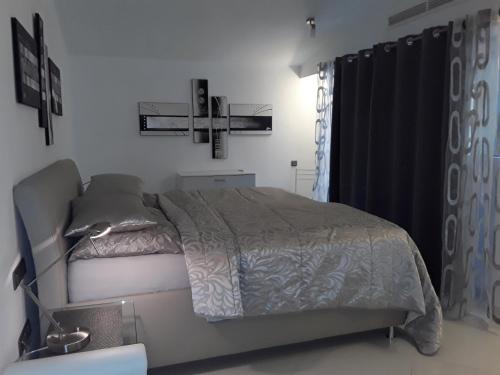 Ένα ή περισσότερα κρεβάτια σε δωμάτιο στο Villa Amelie