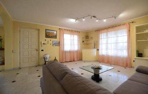 a living room with a couch and a table at Beautiful Home In Capezzano Pianore in Capezzano Pianore,