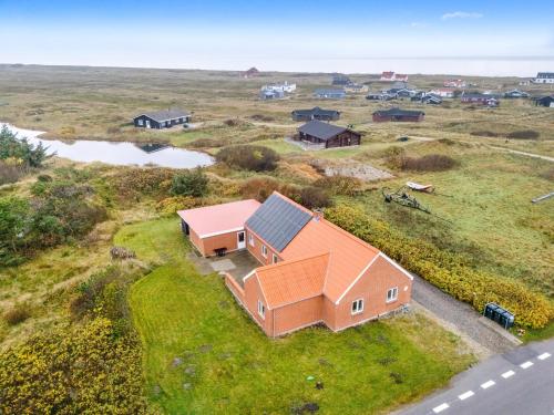 an aerial view of a farm with a house at Lovely Holiday House With 4 Rooms Close To The North Sea in Frøstrup